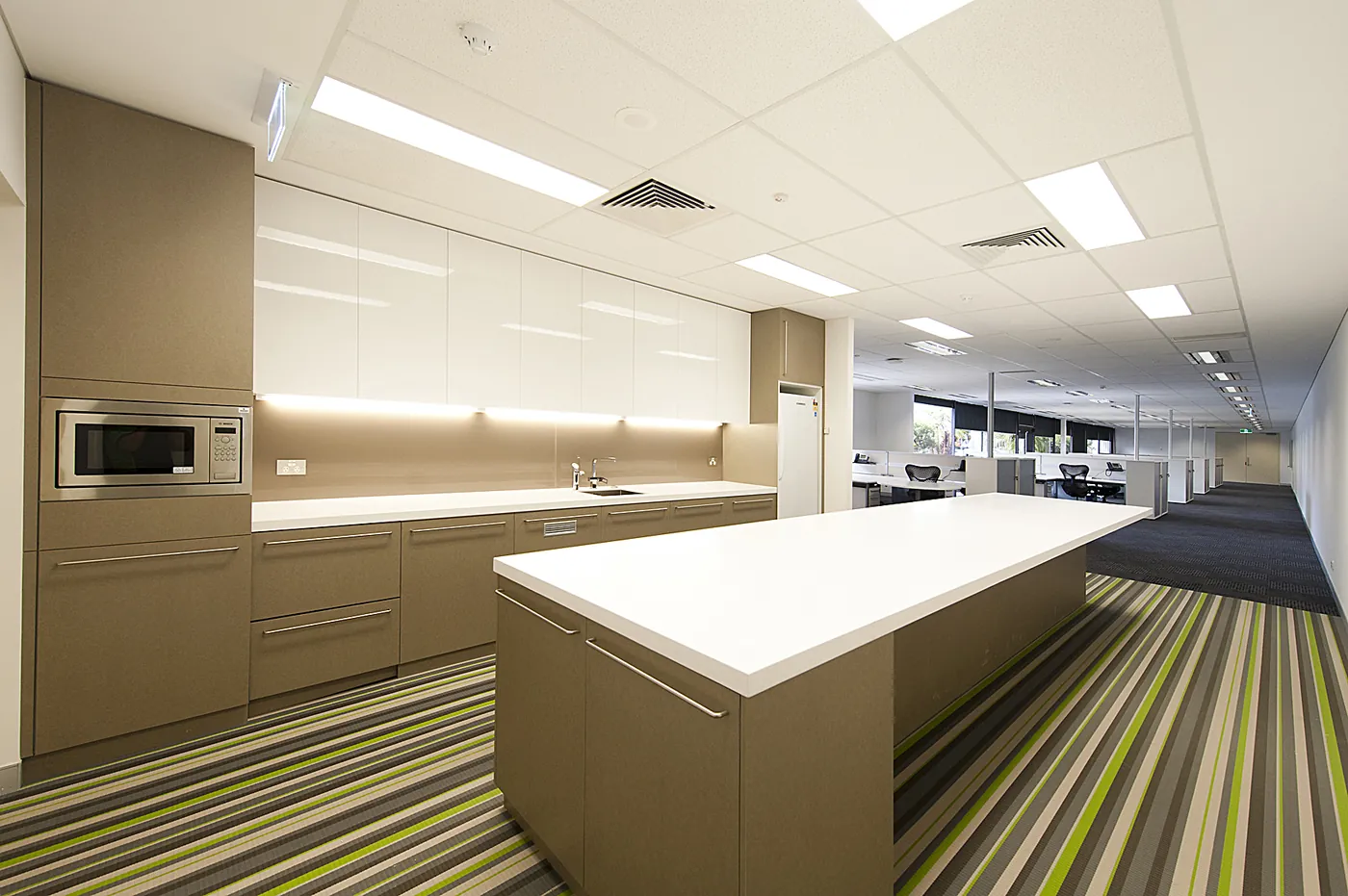 NBN — Staff kitchen and open-plan floor.