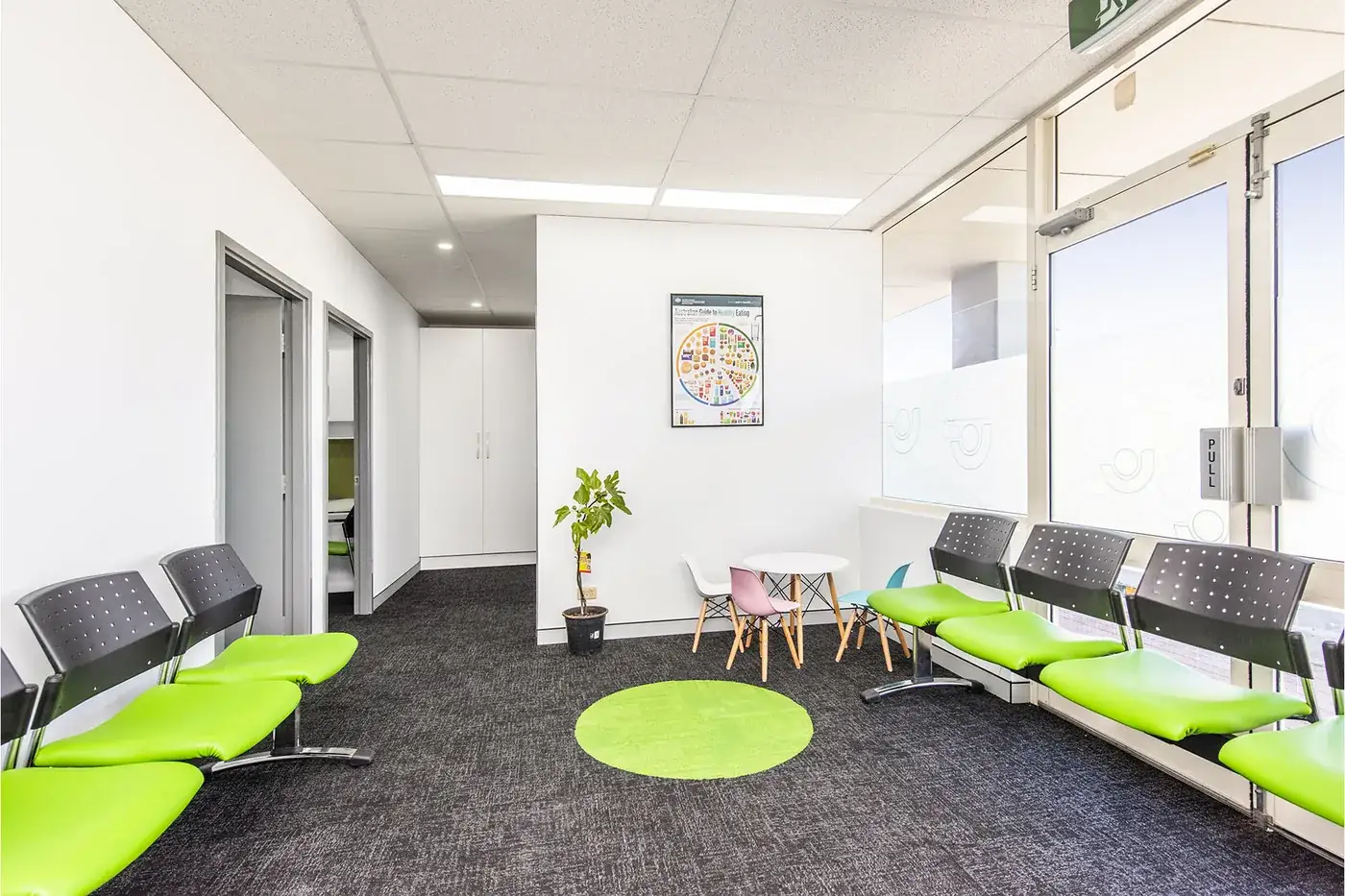 Spearwood Medical — Waiting area with green seating and daylight from the frontage.