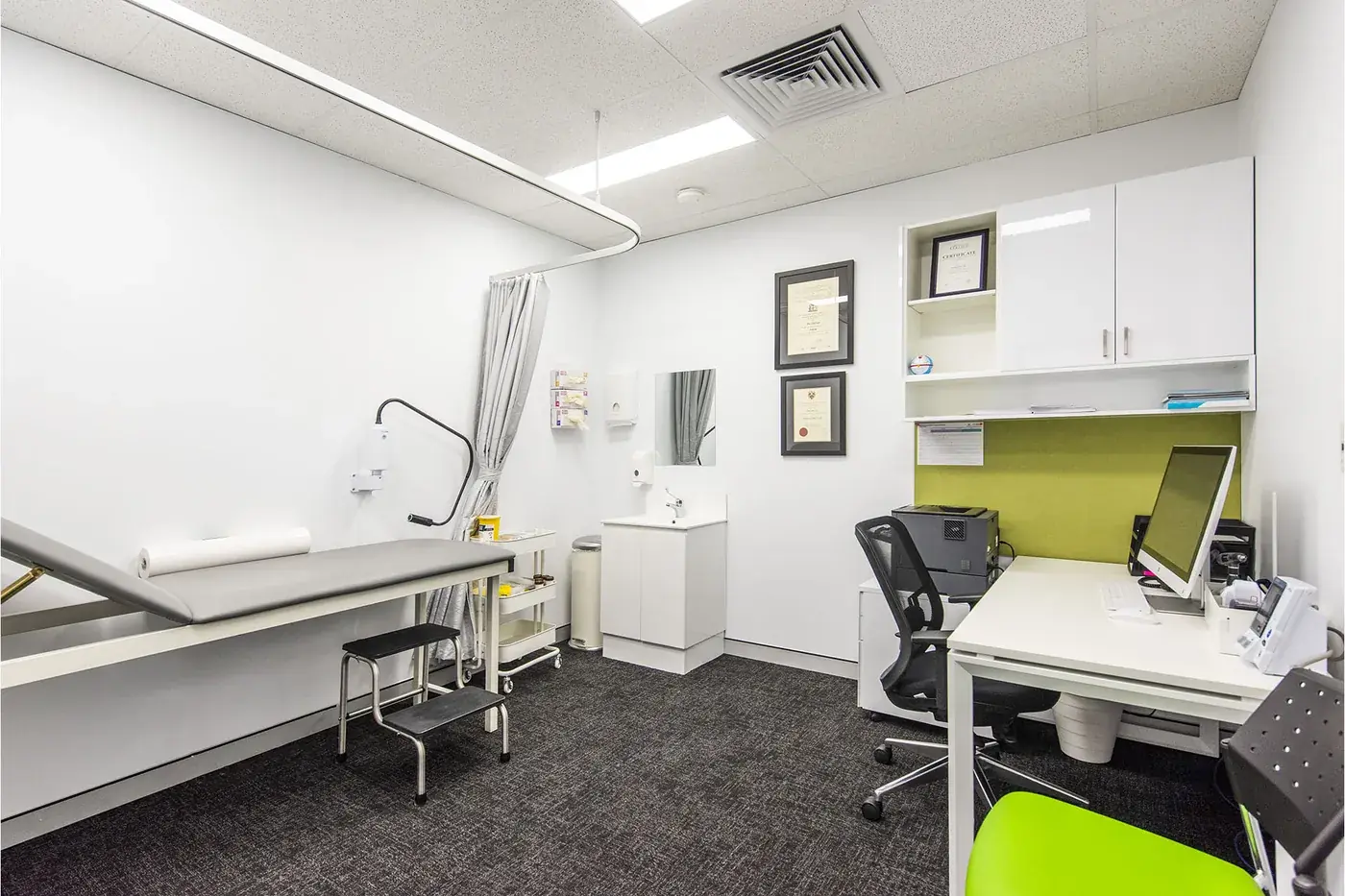 Spearwood Medical — Consulting room with examination bed and joinery.
