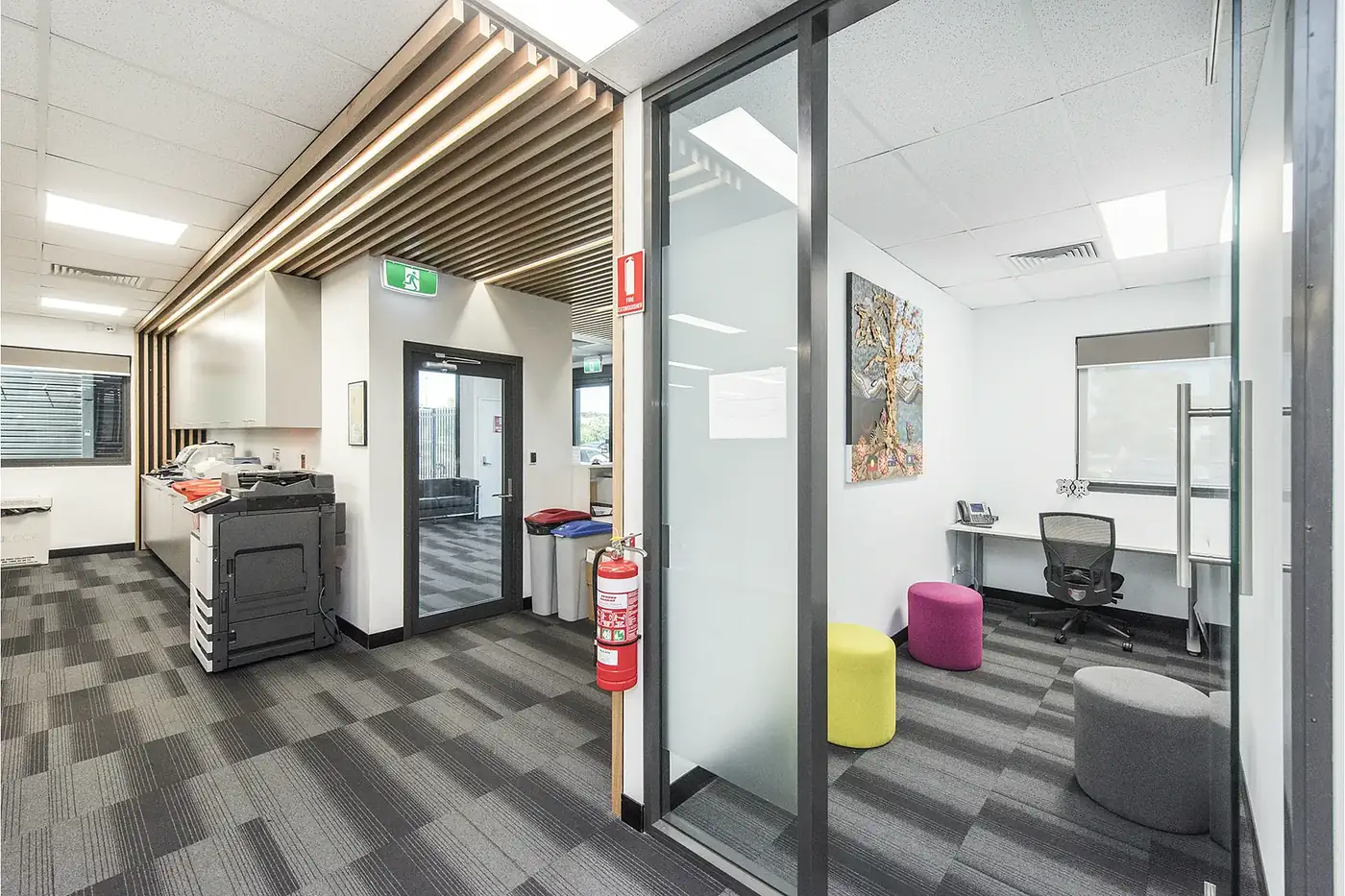 VEOLIA &mdash; private office and breakout with glazed partitions and soft seating.